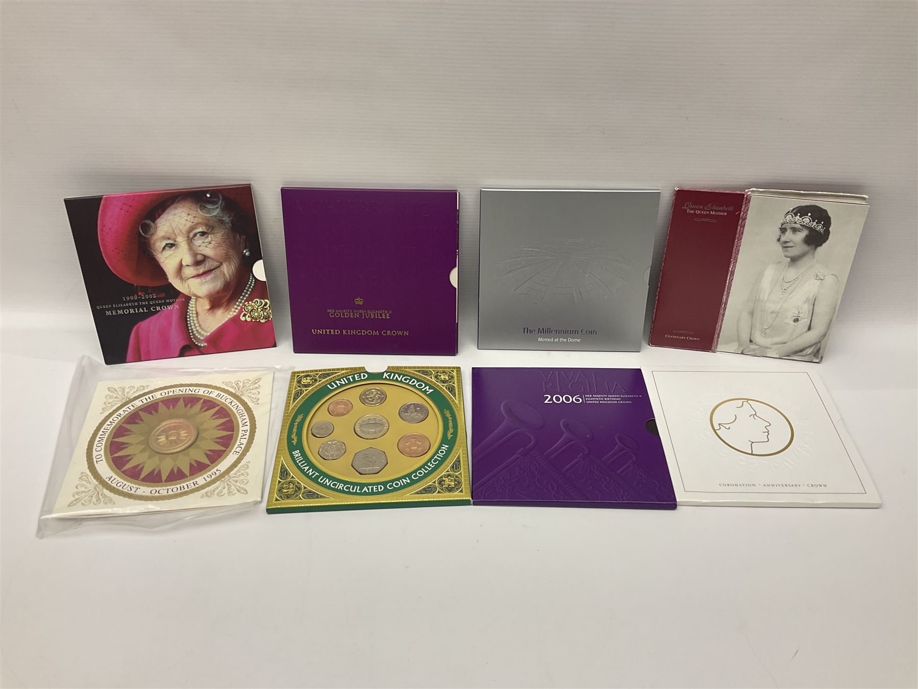 The Royal Mint United Kingdom 'Millennium' silver proof two coin set comprising 1999 and 2000 five pound coins, 2000 'The Queen Mother Centenary Year' silver proof crown, 2001silver proof one pound, 'Her Majesty The Queen Golden Jubilee 1952-2002' silver proof 2002 five pound coin and ten pound banknote set, all being cased with certificates, United Kingdom 1999 brilliant uncirculated coin collection in card folder, other commemorative coinage etc