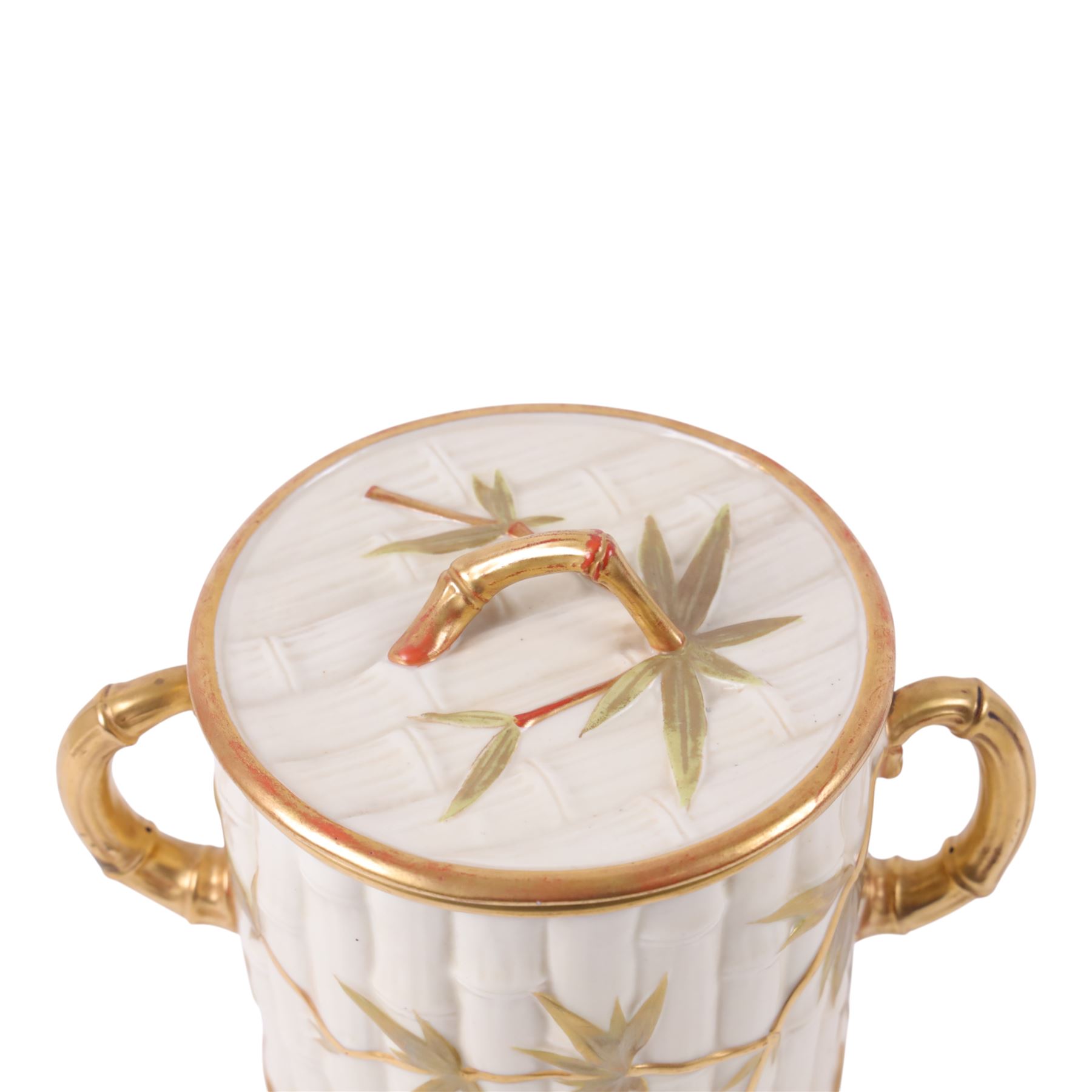 Royal Worcester Blush Ivory twin handled biscuit barrel and lid, in the form of bamboo with gilt highlights, H19cm 