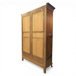 Early 20th century French oak triple door armoire, the moulded top above a frieze with carved lozenge decoration and central rosette, the central mirrored door enclosed by carved surround with floral crest, flanked by panelled doors with lattice carving, the base with shaped apron centred by carved basket motif, upon shaped cabriole supports