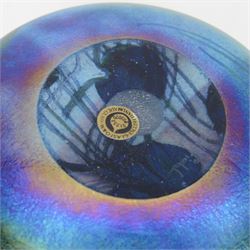 John Ditchfield for Glasform disc paperweight in iridescent blue with purple lily trail and silver hallmarked butterfly to top, D12cm