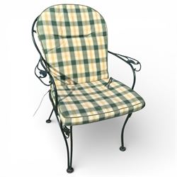 Green painted wrought metal garden table and chairs, with green striped cushions 