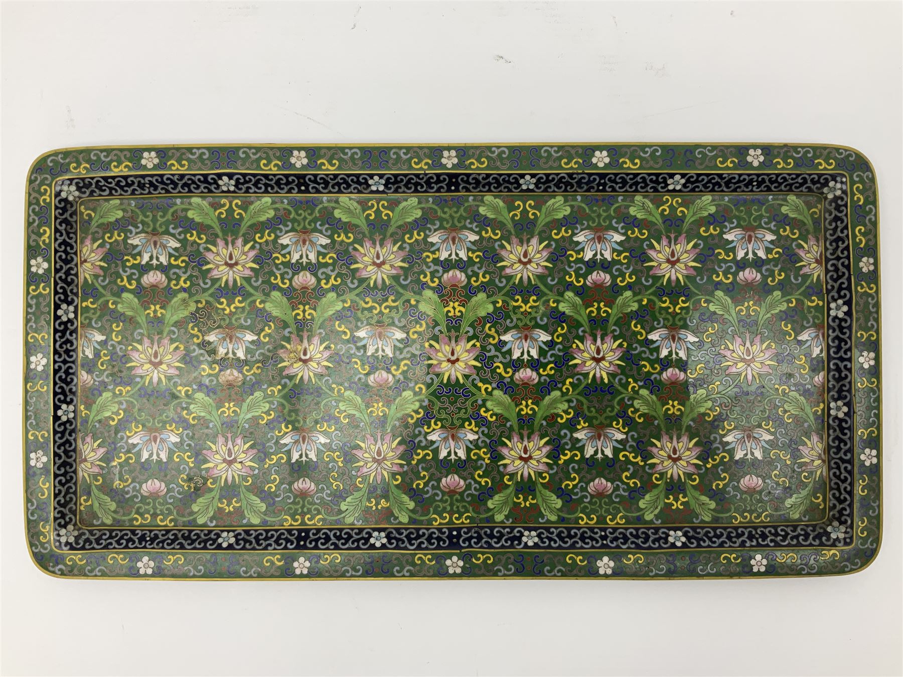 20th century Chinese cloisonne enamel smoking set, comprising two ashtrays, box and tray, with floral and foliate scrolling on green ground