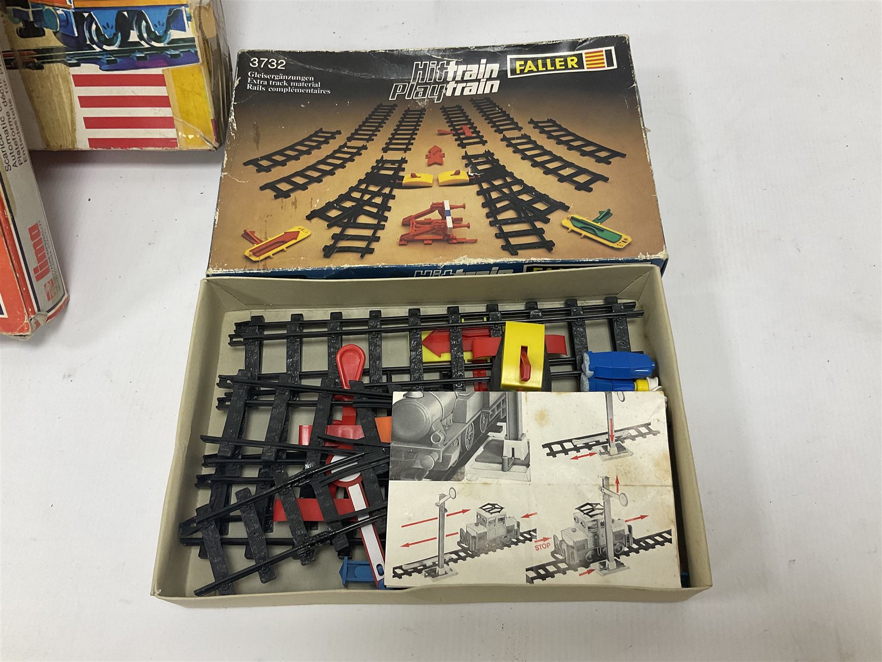 Large quantity of toy railway collectables, to include Faller ‘Hit Train’ boxed sets 3706, 3732, 3753; Lima automatic car unloader, quantity of track and accessories, etc in two boxes 