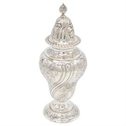 Edwardian silver sugar caster, of typical form embossed with floral decoration, the removable pierced cover with oblique gadrooned rim and bud finial, upon a circular stepped foot, hallmarked Hawksworth, Eyre & Co Ltd, London 1901, H20cm