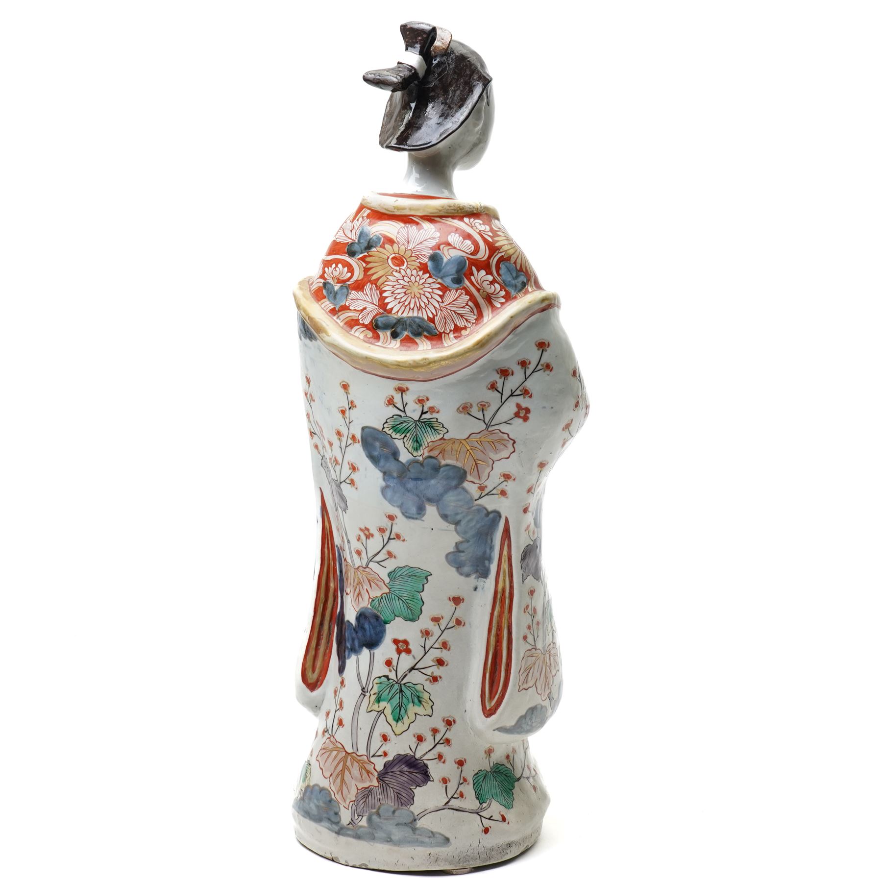 Large Japanese Imari porcelain figure, modelled as a Bijin, wearing a long kimono decorated with apple blossom and leafy branches on a white ground, with gilt detailing, possibly Edo period, H63cm