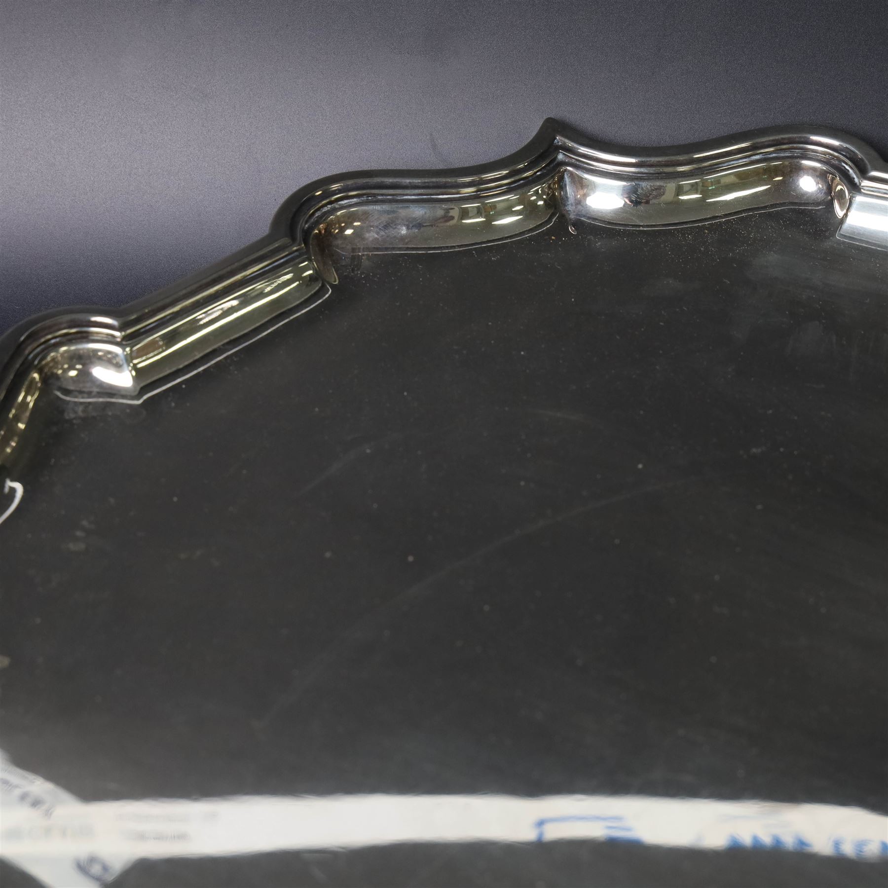 Early 20th century large silver salver, of circular form with Chippendale style rim, upon four hoof feet, hallmarked Elkington & Co Ltd, Birmingham 1918, D47cm