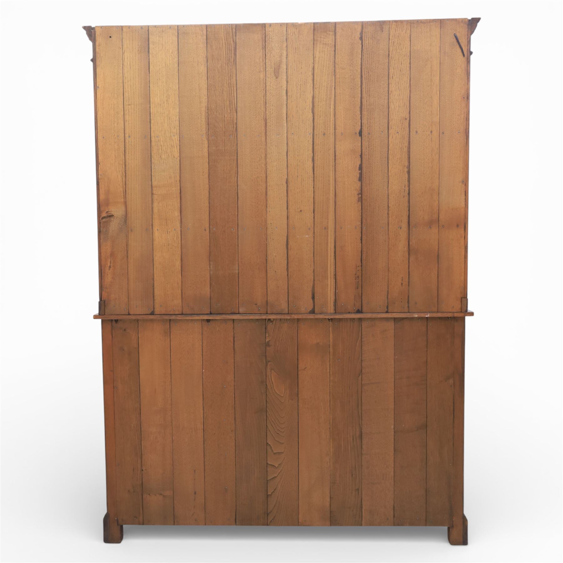 Georgian style oak dresser, the moulded cornice above two open plate racks, upon base with rectangular top above an arrangement of three frieze drawers fitted with brass swan neck handles, and three panelled cupboard doors, upon bracket feet
