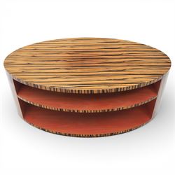 Toby Winteringham - Mid 20th century zebra wood coffee table, oval top with book matched striped veneers over two open tiers painted red, the curved end supports and continuous plinth base veneered to match, recessed plinth base 