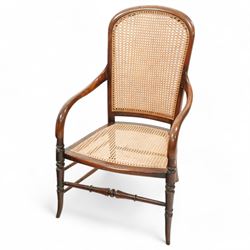 Victorian stained beech frame open armchair, arched cane work back and seat, on turned supports with splayed feet united by turned stretchers 