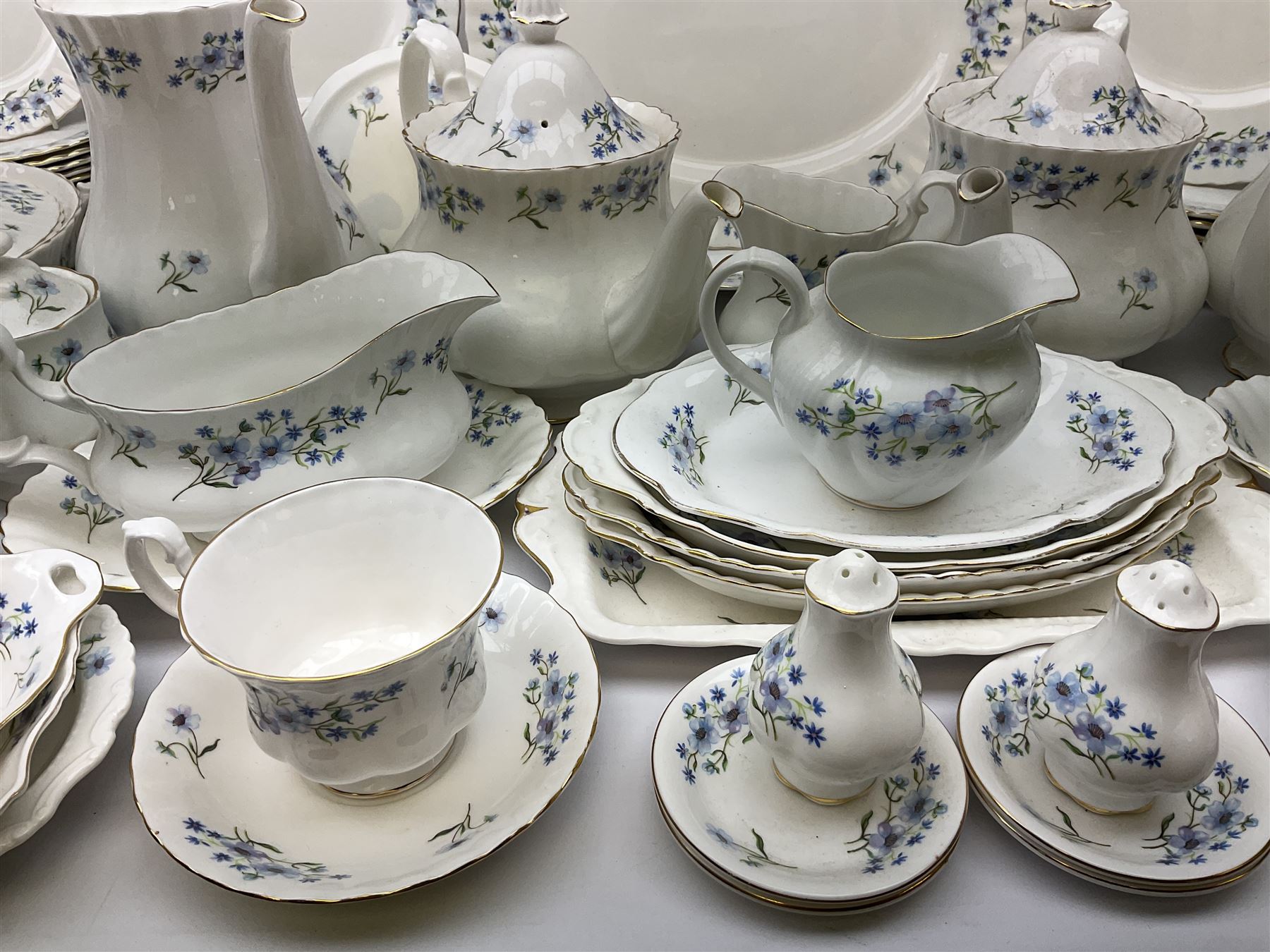 Extensive Richmond Blue Rock pattern part tea and dinner service, to include seven dinner plates, nine smaller plates, three lidded twin handled tureens, two teapots and two coffee pots, eleven bowls, cake stand, six twin handled soup bowls and saucers, six teacups, four coffee cups, milk jugs, sucrier, cake plate, salt and pepper shakers, other plates, dishes, bowls, side plates and many spares etc