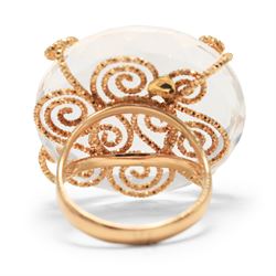 18ct gold rock crystal ring, single round cut crystal, mounted in a fancy textured swirl under setting, stamped 750