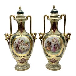 Pair of Vienna style twin handled urns and covers, decorated with figural scene on green, red and white ground with gilt highlights, stamped with beehive mark beneath, H25cm