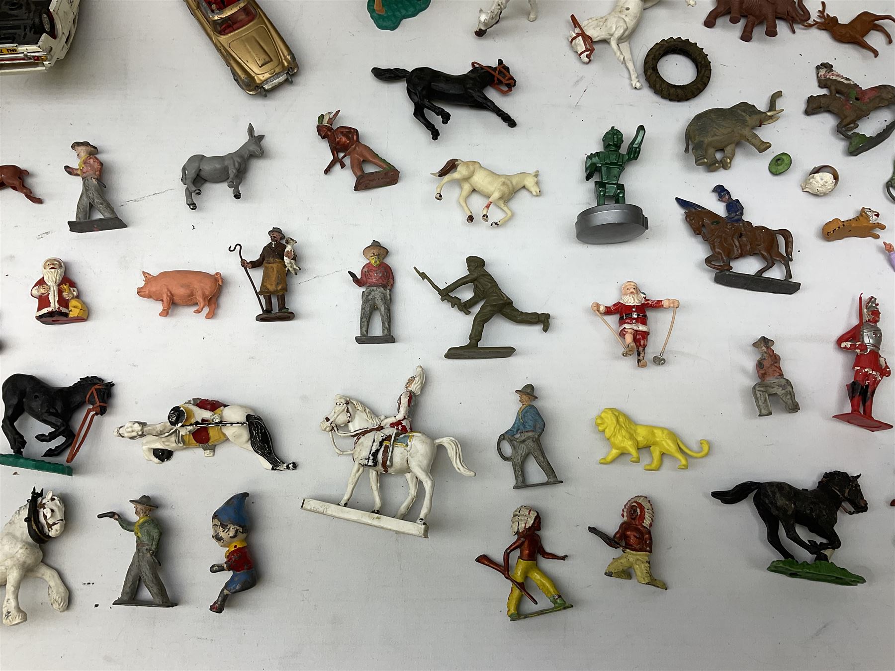 Unboxed and playworn die-cast models of TV/Film interest by Corgi including Green Hornets Black Beauty, two Batmobiles, James Bond Aston Martin DB5, Saints Volvo P1800 etc; two Matchbox 1-75 Series Collector's Cases including various playworn models; and quantity of playworn lead and plastic figures by Britains etc