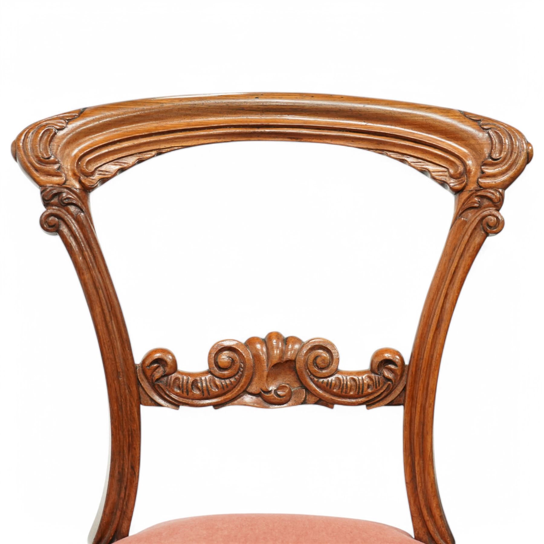 A pair of Victorian walnut balloon back parlours chairs, with carved top rail and back splat with cabriole style legs, Together with a pair Victorian mahogany balloon dining chairs