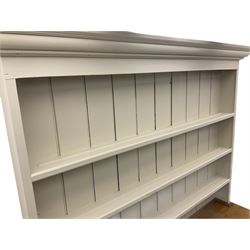 Victorian pine dresser, raised painted three heights plate rack with projecting cornice, waxed top over pained base fitted with three drawers and two double cupboards, bracket feet