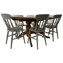 20th century pine extending dining table, oval top over twin bulbous turned pedestal base united by stretcher, with additional leaf (W160cm D120cm H79cm); and set of seven ash painted dining chairs, spindle back, raised on ring turned supports joined by H-stretcher