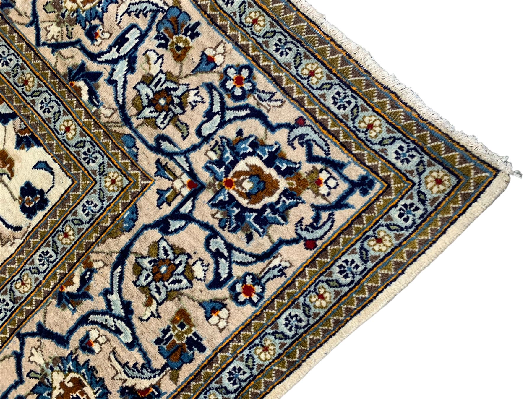 Persian Kashan ivory ground rug, the field decorated with stylised plant motifs and interlacing leafy branches, scrolling border decorated with further plant motifs, floral design guard bands  