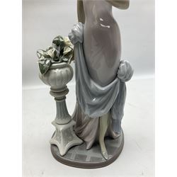 Four Lladro figures, comprising Touch of Class no 5377, Boy Student no 4517, Ocean Beauty no 5785 and Carnival Couple no 4882, largest example H45cm