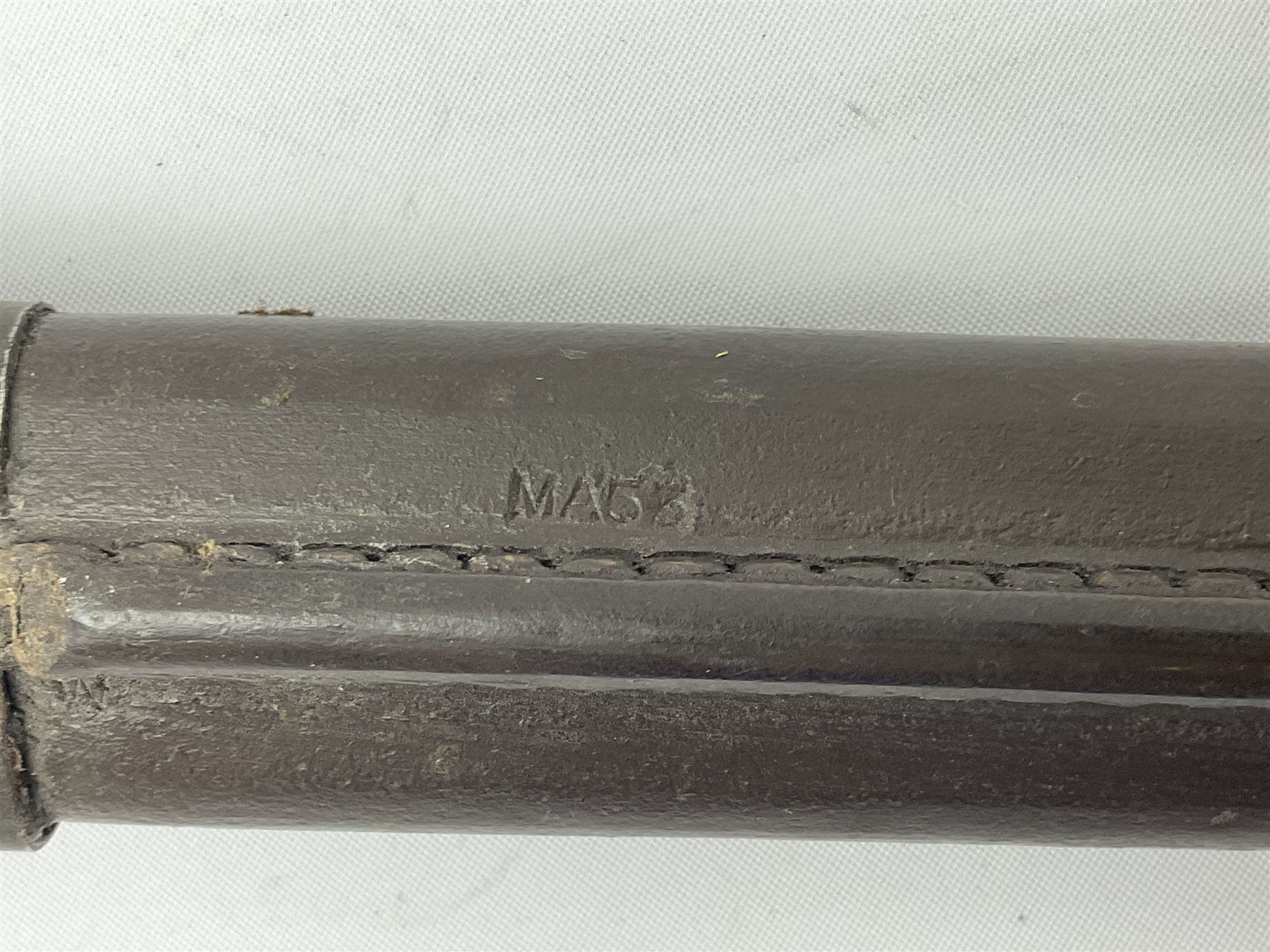 Australian Owen sub-machine gun bayonet, the 25.5cm fullered steel blade marked '53'; in metal bound wooden scabbard marled MA53 L41cm overall