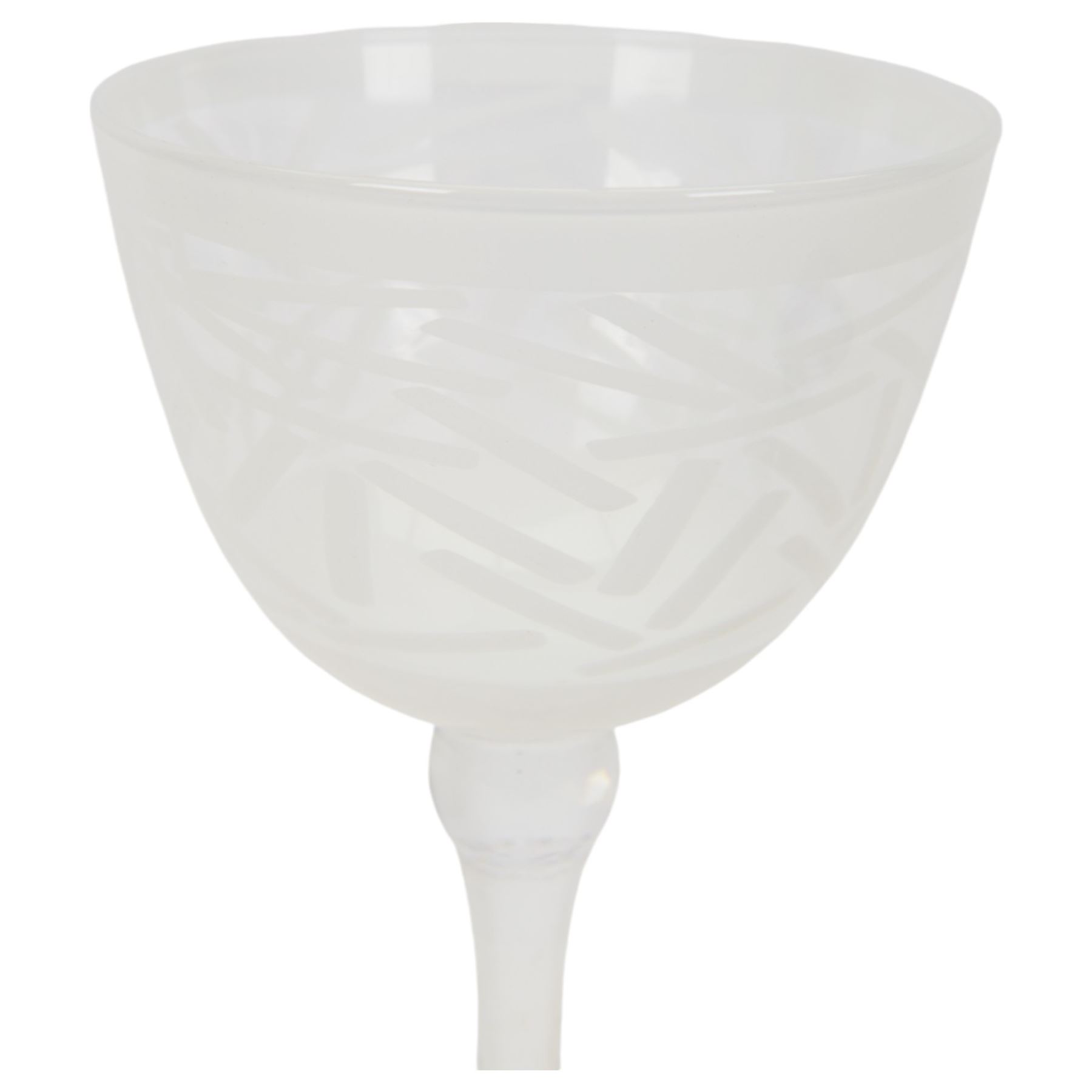 Gillies Jones of Rosedale oversized wine glass, decorated with white abstract decoration, together with a smaller Gillies Jones of Rosedale trumpet shaped wine glass with applied coloured glass ribbon to stem and a Deborah Fladgate purple fluted glass dish, all signed to base, tallest H24.5cm