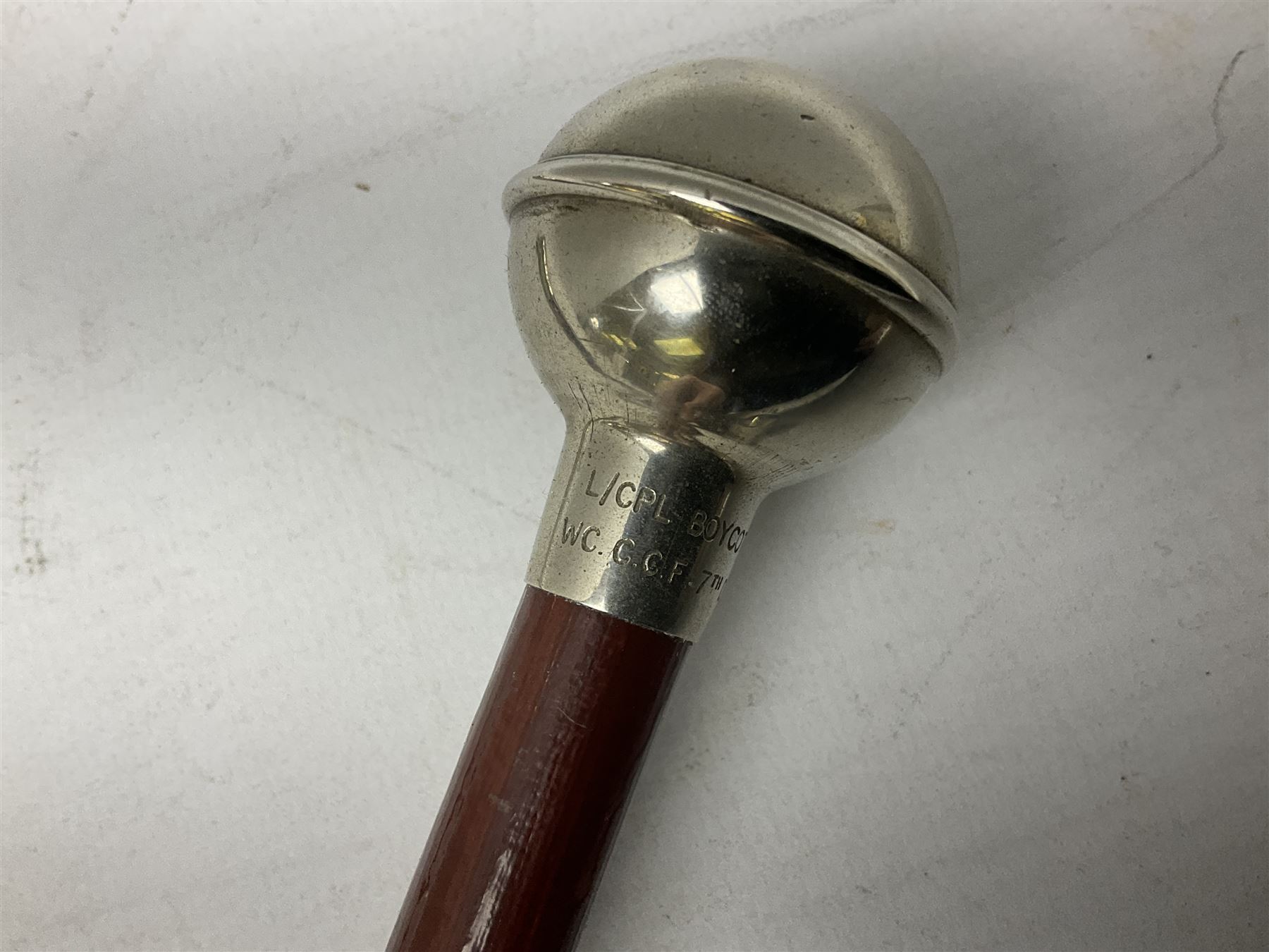 Three military swagger sticks - 14th Foot West Riding POWO Regiment; Northern Cyclist Battalion; both with regimental crests; and another with spherical terminal inscribed L/Cpl. Boycott P.M. WC. C.C.F. 7th Dec. 1960 (Combined Cadet Force?); all with plated mounts (3)