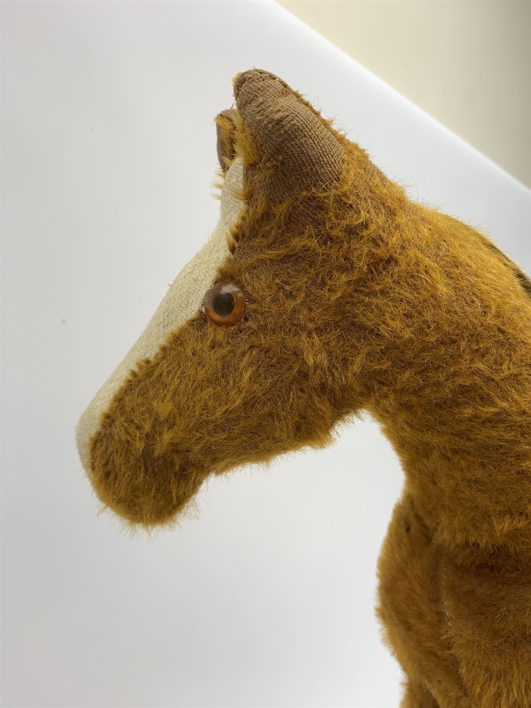 Pedigree push along plush covered horse 1950s-60s with red tubular metal framework and beech foot rests H25