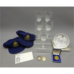  Collection of QE II Cruise Memorabilia including: set of five 1977 Jubilee wine glasses, money clip and medallion, two 1994 World Cruise baseball caps, six-Continent Circumnavigation Plate and Medal, c1950's RMS Queen Mary Cocktails & Cigars Price list, and Train Ticket (12)   