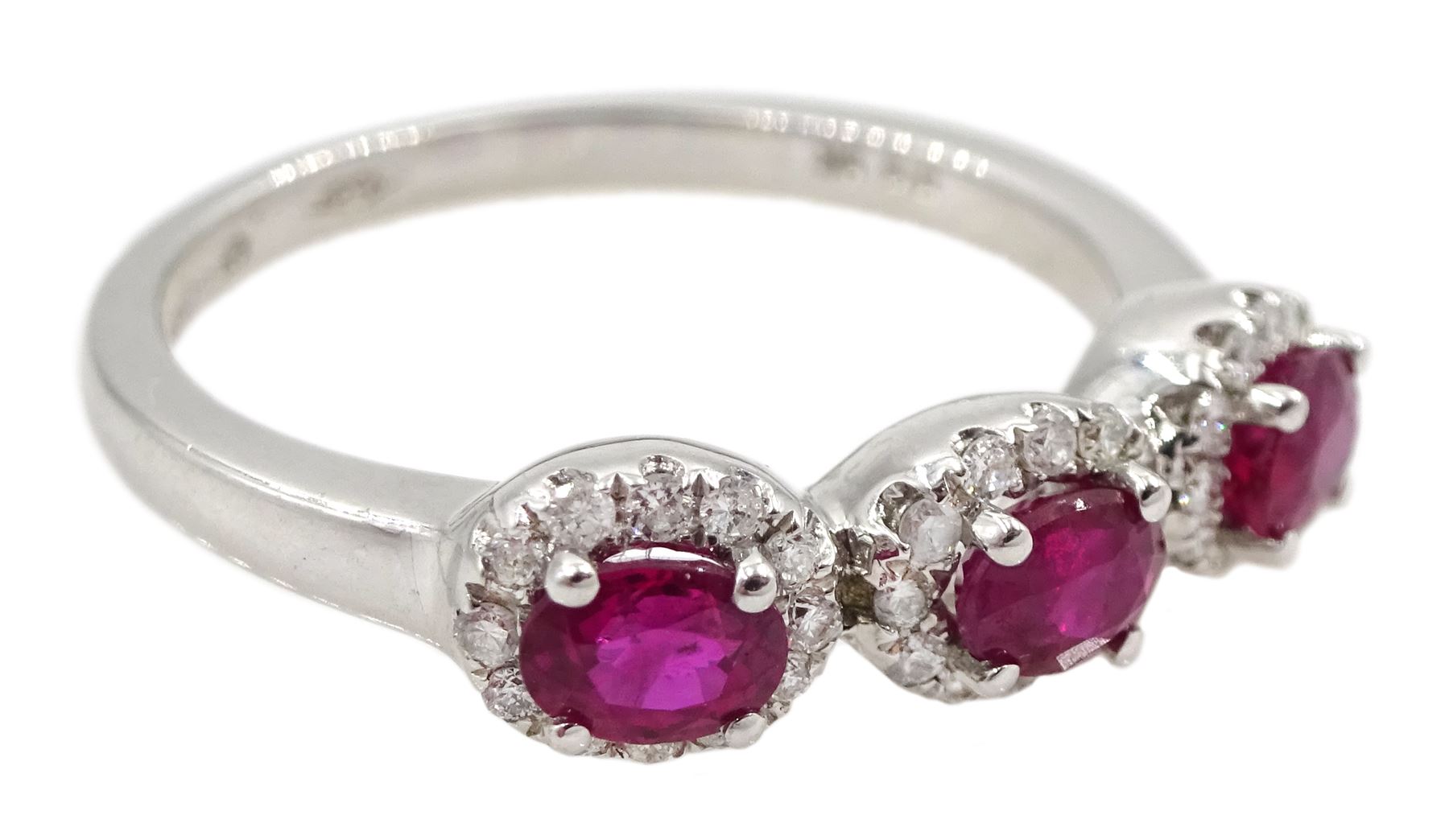 White gold three stone oval ruby and round brilliant cut diamond cluster ring, hallmarked
