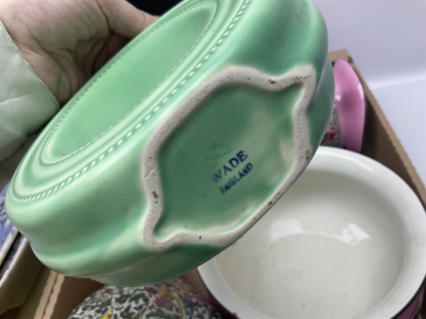 Blue and white meat platter and a similar blue and white meat draining plate, together with a pink ceramic floral jug and bowl, three packs of church candles and a wooden screen, etc 