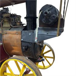 Mid-20th century scratch-built red and yellow painted live-steam scale model of a Showman's Traction Engine, 'Supreme' S.A. Oates & Sons, the simulated full length planked wooden canopy with brass supports and rope edging, with regulator, hand brake, chain steering , dynamo and water feed controls 19cm flywheel, 32cm diameter rear wheels with solid rubber tyres and 21cm diameter front wheels L102cm; together with scratch-built ride-on two-wheel trailer L58cm, and various brass rally plaques for 1980s/1990s.
This is a large, most interesting and comprehensive live-steam working model in need of re-furnishment and some repairs, the boiler has not been tested.