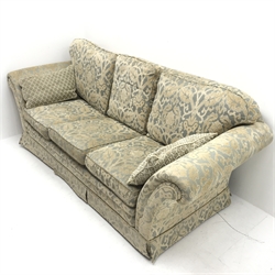 Three seat sofa upholstered in a floral patterned gold and teal fabric, scrolling arms (W240cm) and a matching armchair (W97cm)