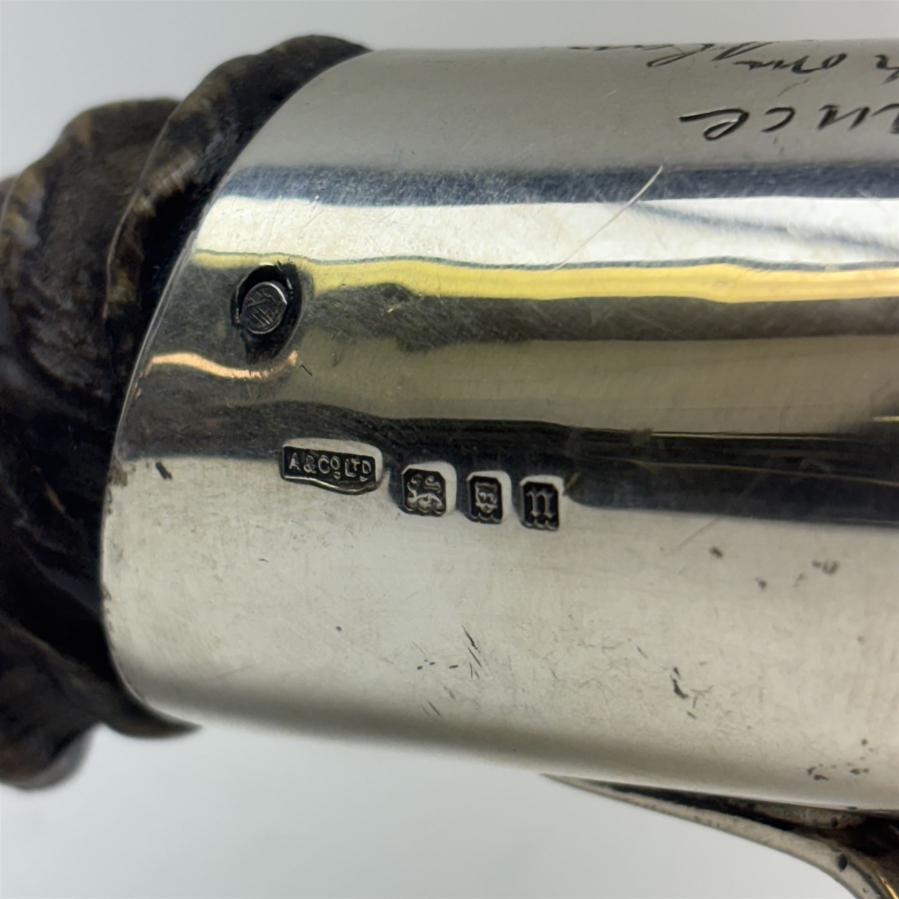 Early 20th century silver and blackbuck horn table lighter, the spherical burner in gimble, mounted and supported by two curved silver feet and horn, hallmarked Asprey & Co Ltd, London 1928, approximately L50cm


