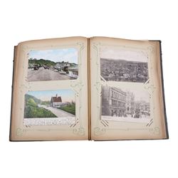 Collection of early 20th century postcards and greetings cards, including WWI embroidered silk Christmas card, black and white family photographs, 1920s birthday cards, black and white and colour postcards of Margate, Ramsgate, Blackpool etc, housed in three postcard albums