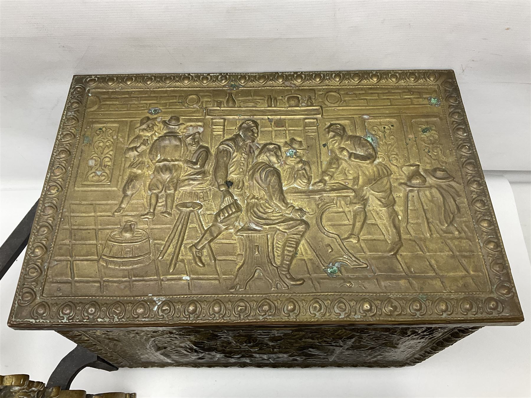 Pair of brass and iron fire dogs, together with brass coal box embossed to the lid with figures and a brass magazine rack, coal box H32cm