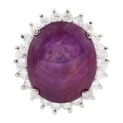 Platinum cabochon star ruby and round brilliant cut diamond cluster ring, stamped Pt900, ruby 12.57 carat, total diamond weight 0.88 carat
