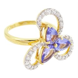 18ct gold tanzanite and diamond cluster ring, three pear cut tanzanite's, with round brilliant cut diamond surround, in an openwork swirl setting, hallmarked, total tanzanite weight 1.50 carat, total diamond weight 0.55 carat, with World Gemological Institute Report