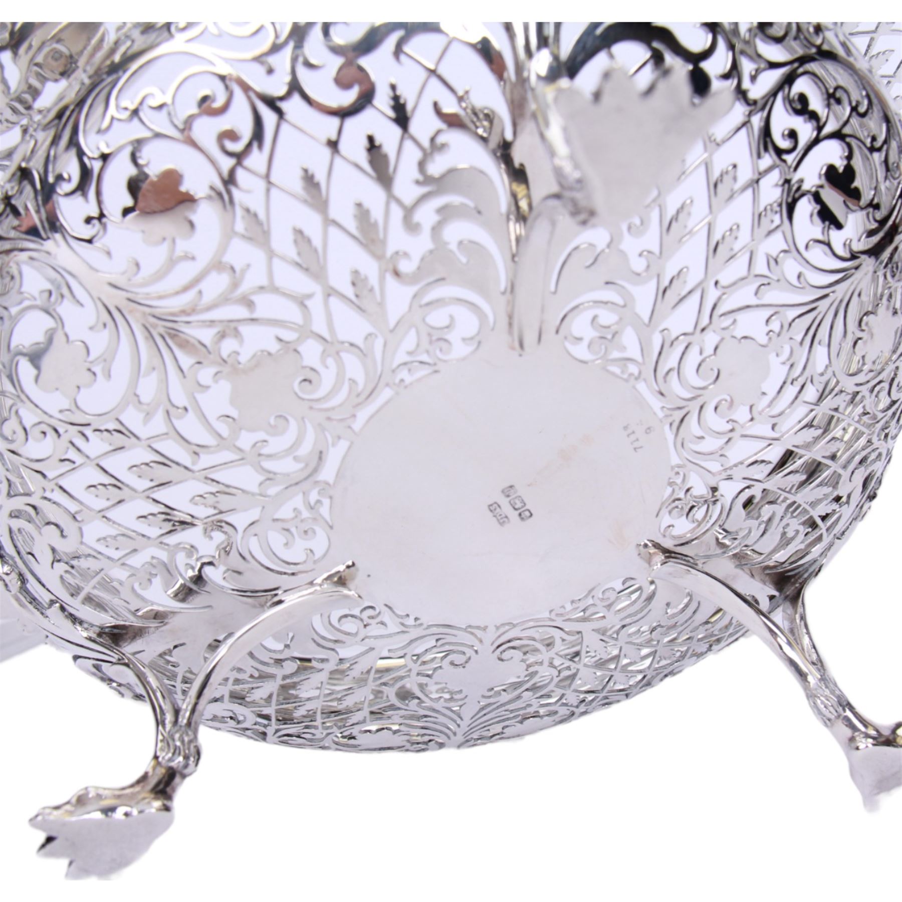 Early 20th century pierced silver bowl, of circular form with shaped rim with C scroll and foliate edge, the whole profusely pierced, upon three paw feet, hallmarked James Dixon & Sons Ltd, Sheffield 1916, H9cm D22.5cm