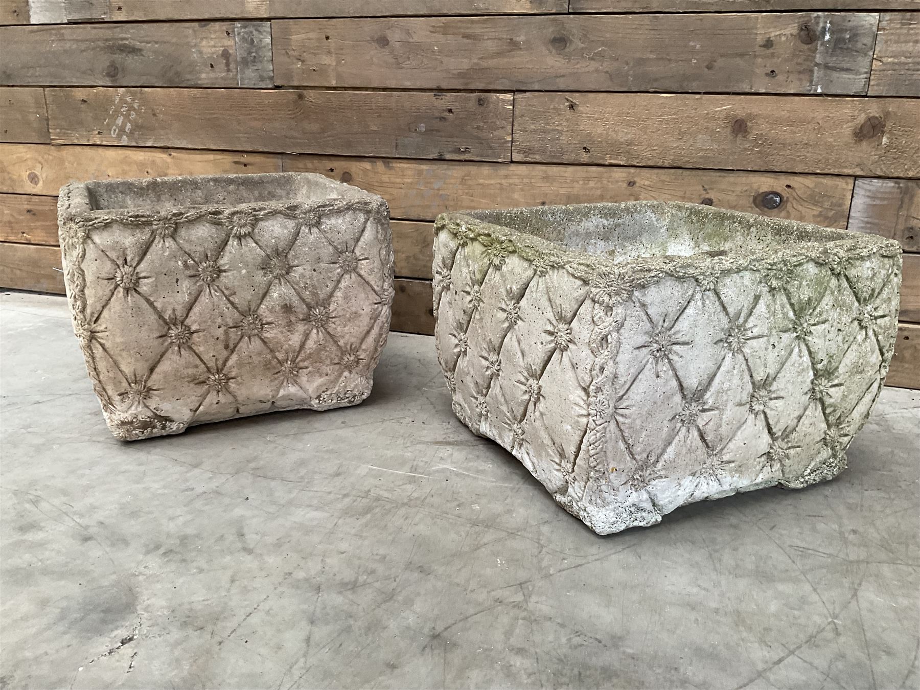 Pair of weathered cast stone square planters, daisy chain detail, one stamped