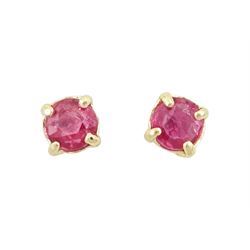 Pair of 9ct gold round cut ruby stud earrings, stamped