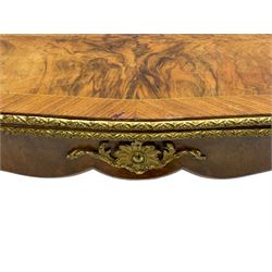 20th century French walnut and Kingwood card table, shaped fold-over top with figured quarter-matched veneers and floral egg and dart moulded edge in gilt metal, shaped aprons decorated with shell motifs with extending foliage, pull-out action base revealing storage well, on cabriole supports with ornate gilt metal mounts 