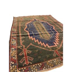 Persian Baluchi, overall geometric design, the field with lozenge and trailing foliage, repeating border decorated with geometric motifs