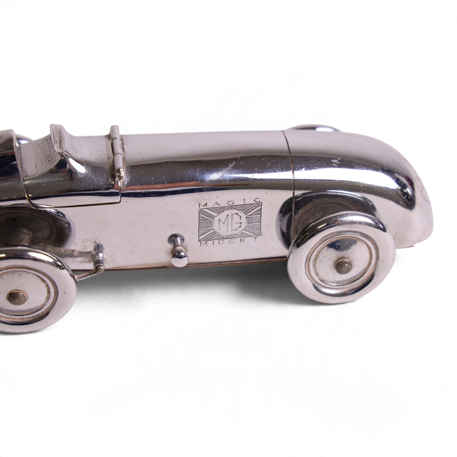 MG Magic Midget table lighter, circa 1933, chrome plated, engraved to the nose and on one side, marked beneath 'S&M, Made in England, Pat. no. 373219' 