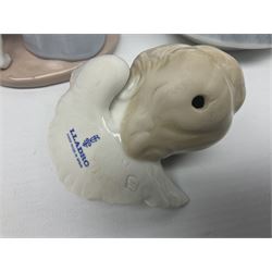 Three Lladro figures, comprising Dear Santa no 6166, Angelic Melody 1993 no 5963 and Seraphs Head no2 no 4885, together with Lladro plaque Love Brings Us Together no 7677, all with original boxes, largest example H18cm