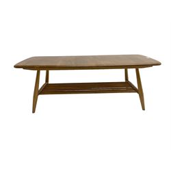 Ercol - elm and beech coffee table, rectangular top on splayed supports joined by undertier