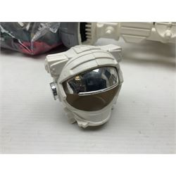 Action Man - large collection of 1960s and later figures and accessories including Spaceman with ATLRV vehicle; two figures marked 'Made in England by Palitoy under licence from Hasbro 1964'; twenty-five assorted weapons; radio backpacks; kit bags; twenty-one pairs of boots; football boots and snow shoes; metal diver's boots and three pairs of flippers; two pairs of jackboots; roller skates; various tunics, trousers, flying suits, jumpers, belts etc; twenty helmets, berets, busby, kepis, submariner etc; and quantity of other accessories