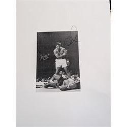 Large colour print depicting the famous scene of boxer Muhammad Ali standing over the defeated Sonny Liston, taken from their 1964 rematch, signed by Ali to the left middle in gold marker, with his double signature 'Muhammad Ali AKA Cassius Clay', with certificate of authenticity from Fraser's Autographs, framed, picture H49cm