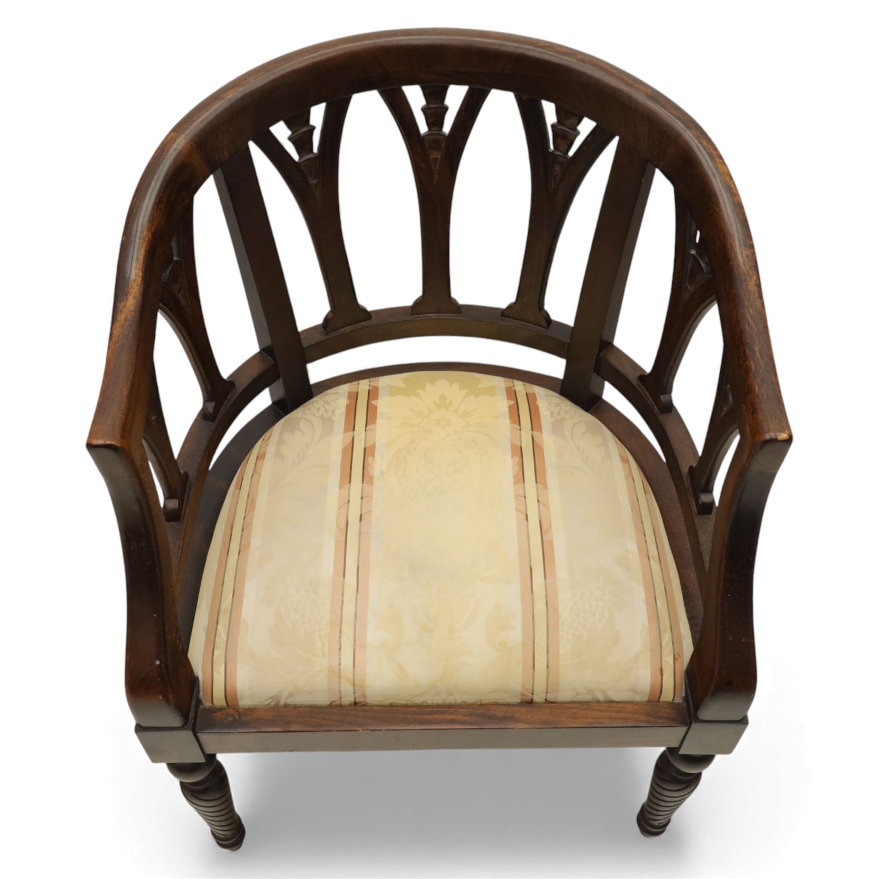 Late 20th century mahogany tub armchair, curved open back with pierced splat supports beneath a rounded top rail, upholstered drop-in seat in patterned fabric, raised on turned and ringed supports