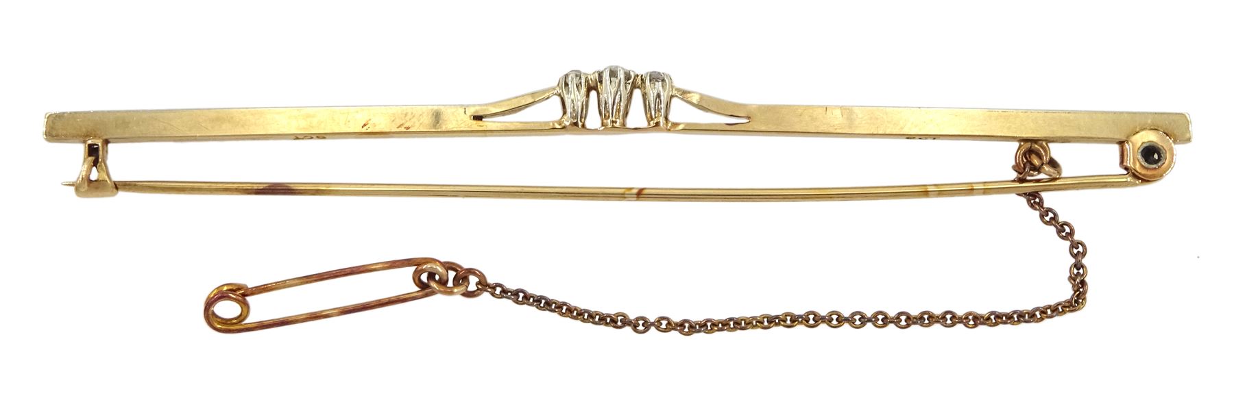 9ct gold bar three stone round brilliant cut diamond bar brooch, stamped and in fitted box 