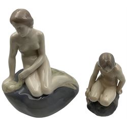Two Royal Copenhagen figures, comprising The Little Mermaid, modelled by Edvard Eriksen, no. 4431 and Royal Copenhagen girl on stone no 4027, Little Mermaid H22cm