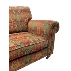 Duresta - 'Beaminster' grande two-seat sofa, traditional shape with rolled arms, upholstered in 'Althorp' russet and stone floral pattern fabric, on turned feet with brass castors
